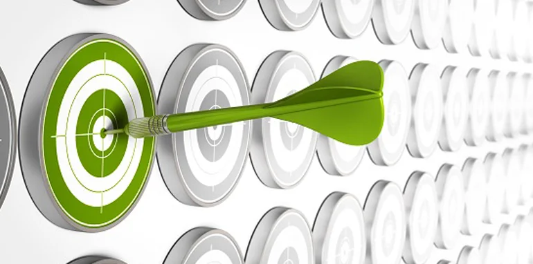 green dart in the bullseye of a target board